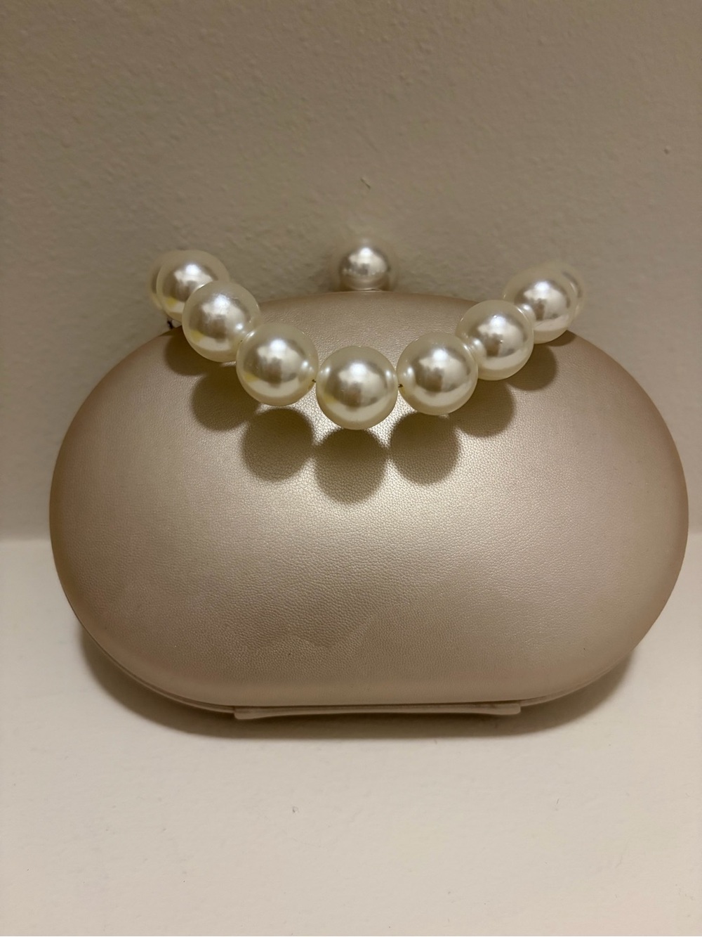 Olga Berg Pearl Handle Clutch in Champagne With Chain shoulder Strap